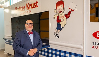 Stephen posing in front of a bread truck